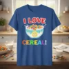 I LOVE CEREAL! text with a bowl of colorful cereal and a smiley face graphic on a blue t-shirt