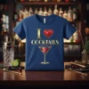 Blue t-shirt with gold text "I Love Cocktails" and a graphic of a martini glass with cherries, featuring a red