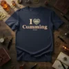 Navy blue t-shirt with text "I Love Cumming Georgia" and a heart graphic, representing the I Love Cumming Georgia design