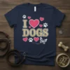 I Love Dogs T-Shirt featuring pink hearts, paw prints, and a butterfly graphic
