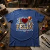 I Love Felix text with steampunk hot air balloon and heart graphic on a blue t-shirt