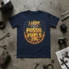 I Love Fossil Fuels t-shirt with a skull graphic, flames, and smoke, set against a circular vintage badge with the
