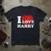Black t-shirt with a distressed red heart and white text reading "I LOVE HARRY"