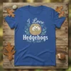 I Love Hedgehogs t-shirt design featuring a cute hedgehog illustration surrounded by foliage