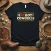 I Love Hot Cowgirls text with heart graphic on a navy t-shirt, western style design