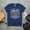 Navy blue t-shirt with white and gold text that says "I Love It When My Husband Takes Me Shopping" and