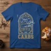 I love Jesus and Coffee and CARBS COFFEE AND CARBS text design on a royal blue t-shirt, featuring ornate arch