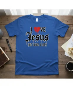 I Love Jesus But I Cuss A Lot humorous Christian t-shirt design with a broken heart graphic and gothic font