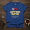 Blue t-shirt with text "I Love Jewish Boys" featuring a red heart, gold glitter lettering, and menorah graphics