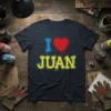 I Love Juan t-shirt design with blue 'I', red heart, and yellow 'JUAN' text with spray paint splatters