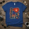 I Love LA t-shirt design with a red heart, Los Angeles skyline, and palm trees