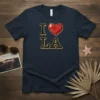 I Love LA T-Shirt featuring a gold outlined "I" and "LA" with a large, red, diamond-like heart graphic in between