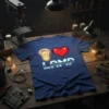 I Love Lamp t-shirt design featuring a neon light bulb, pixel heart, and metallic text on a blue shirt