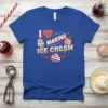 Blue t-shirt with the text "I Love Making Ice Cream" and illustrations of ice cream cones and cherries