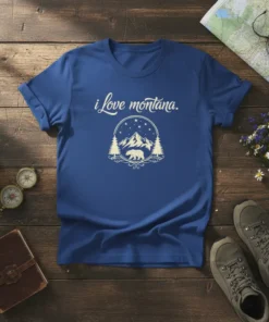 Blue t-shirt with "i love montana." text above a circular graphic of mountains, stars, trees, and a bear