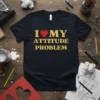 Black t-shirt with gold text "I Love My Attitude Problem" and a red heart graphic