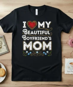 I Love My Beautiful Boyfriend's Mom text design with a red heart and floral accents on a black t-shirt