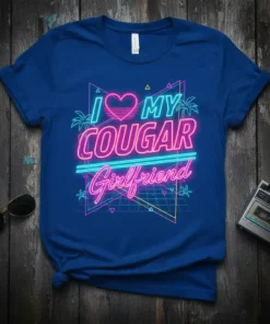 I Love My Cougar Girlfriend text with neon heart and retro geometric graphics on a blue t-shirt