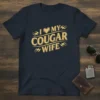 I Love My Cougar Wife t-shirt design with a heart and flames graphic, printed in gold on a navy shirt