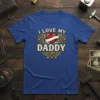 I Love My Daddy text with a heart and banner graphic on a blue t-shirt