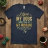 I Love My Dogs More Than My Husband quote on a navy t-shirt with distressed gold and green lettering and