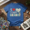 I Love My Granny t-shirt design with a red heart and a patchwork heart, yarn, and knitting needles graphic