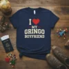 Navy blue t-shirt with white text "I Love My Gringo Boyfriend" and a red heart graphic