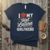 I Love My Hot Latina Girlfriend text design with a flaming heart and decorative swirls on a navy t-shirt