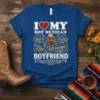 I Love My Hot Mexican Boyfriend text design with a heart and sacred heart graphic on a blue t-shirt