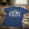 T-shirt with "I Love My Mother In-Law" text in white and gold, featuring a heart with flowers and two doves