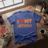 Blue t-shirt with orange text "I Love My Nephew" and a red heart graphic