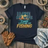 I LOVE MY WIFE IT WHEN LETS ME GO FISHING text design with sunset and boat graphic on navy t-shirt
