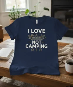 I Love Not Camping text with graphic of person lounging on a couch on a navy t-shirt