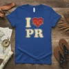 Blue t-shirt with "I Love PR" design, featuring a red heart with a castle graphic and distressed yellow lettering