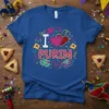 Royal blue t-shirt with "I Love Purim" text, glitter hearts, masks, and hamantaschen graphics for Jewish holiday celebration