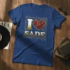 I Love Sade t-shirt design with gold text, red heart, and musical notes inside a decorative border