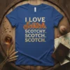 I LOVE Scotch. SCOTCHY. SCOTCH. SCOTCH. text design on a blue t-shirt, featuring vintage-style lettering for "Scotch."