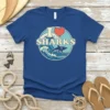 Blue t-shirt with "I Love Sharks" text and a vintage wave graphic featuring a shark