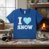 I Love Snow T-Shirt featuring white text "I" and "SNOW" with a blue diamond heart graphic, perfect for winter lovers