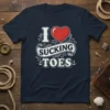 I Love Sucking Toes t-shirt with a red heart graphic and vintage-style typography