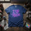 I Love Taylor graffiti design on a navy t-shirt with a pixelated heart graphic and pink and blue spray paint