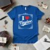 Blue t-shirt with "I Love Taylor" text and a red heart inside a decorative frame