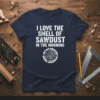 White text "I Love The Smell Of Sawdust In The Morning" with a circular saw blade graphic on a navy