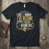 I LOVE the WOMAN I'VE BECOME BECAUSE I FOUGHT to BECOME HER quote with lion head graphic on black t-shirt