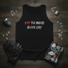 Black tank top with white text "I love to make boys cry" featuring a red heart graphic