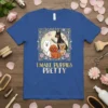 I Make Puppies Pretty text with four cute dogs: Samoyed, Poodle, Doberman, and Yorkshire Terrier, on a blue t-shirt
