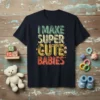 I MAKE SUPER CUTE BABIES text design with colorful distressed typography and baby faces graphic on a navy t-shirt