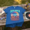 Blue t-shirt with text "I MATCH ENERGY SO HOW WE GON'ACT TODAY?" and a retro vinyl record graphic