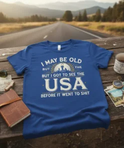Blue t-shirt with white text "I May Be Old But The USA Before It Went To Shit" and graphic of