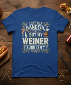 I May Be A Handful But My Weiner Sure Isn't text with hot dog graphics on a blue t-shirt